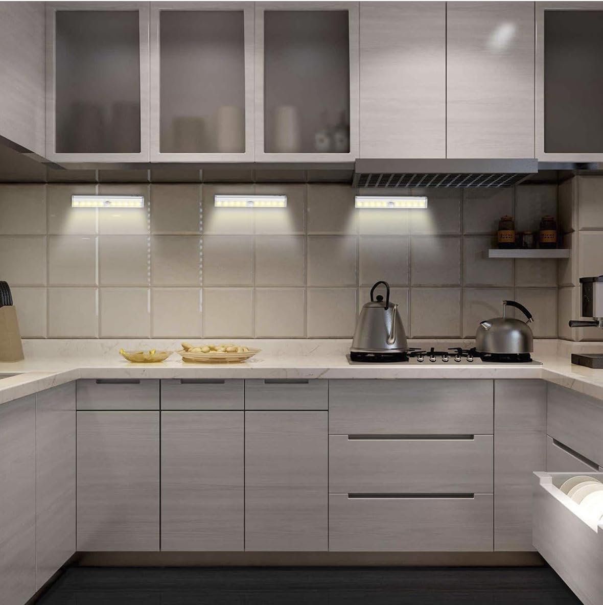 Stick on motion sensor LED light in kitchen cabinet under shelf hands free